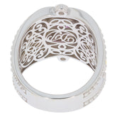 Intricate design of a sterling silver ring showcasing ornate filigree detailing on the inside.